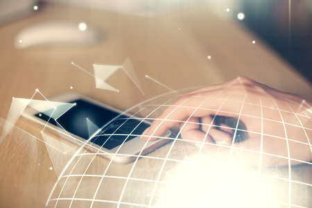 Double exposure of map sketch hologram and woman holding and using a mobile device.