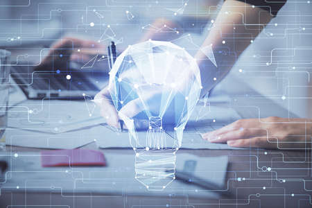 Double exposure of woman hands typing on computer and light bulb drawing. Idea concept.