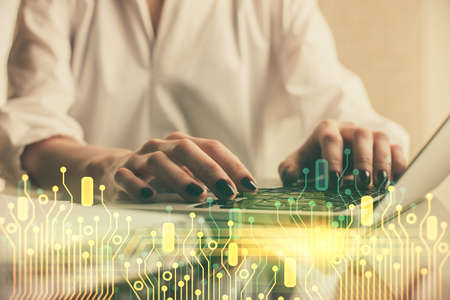 Double exposure of woman hands working on computer and data theme hologram drawing. Tech concept.