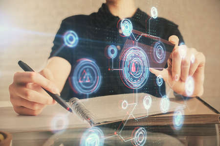 Double exposure of man hands holding a credit card and data theme drawing. E-commerce and technology concept.の写真素材