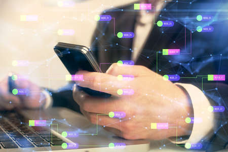 Multi exposure of man's hand holding and using a digital device and data theme drawing. Innovation...