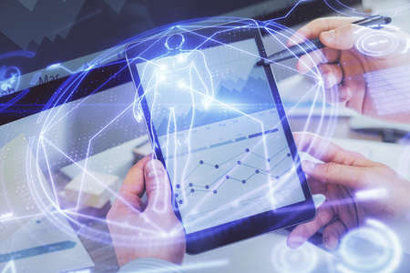 Double exposure of man's hands holding and using a phone and education theme drawing.