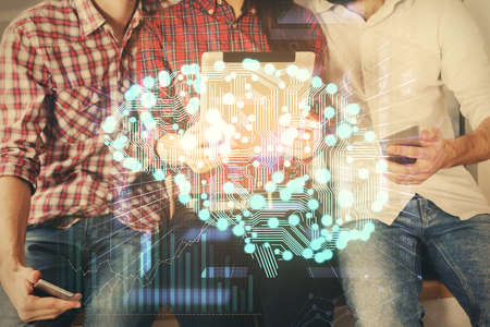 Double exposure of man and woman working together holding and using a mobile device and brain hologram drawing.の写真素材