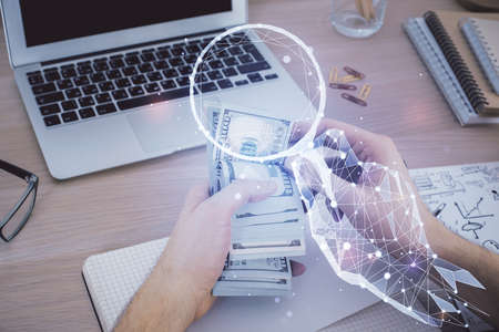 Multi exposure of creative drawing hologram and USA dollars bills and man hands. Start up concept