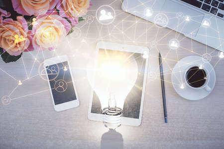 Double exposure of social network theme drawing over table with phone. Top view. People connecting concept.の写真素材