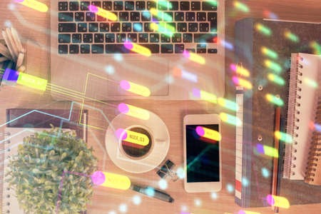 Double exposure of technology theme drawing over work table desktop. Top view. Global data analysis concept.の写真素材