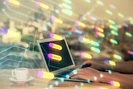Multi exposure of woman hands working on computer and data theme hologram drawing. Tech concept.
