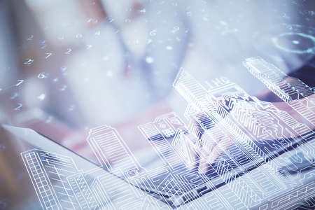 Double exposure of woman hands typing on computer and buildings drawing. Smart-city concept.