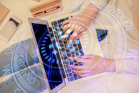 Double exposure of woman hands working on computer and data theme hologram drawing. Top View....