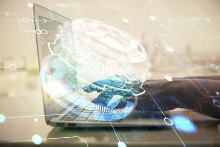 Double exposure of woman hands working on computer and data theme hologram drawing. Tech concept.
