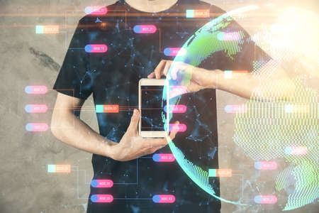 Multi exposure of man's hands holding and using a digital device and map drawing. International...
