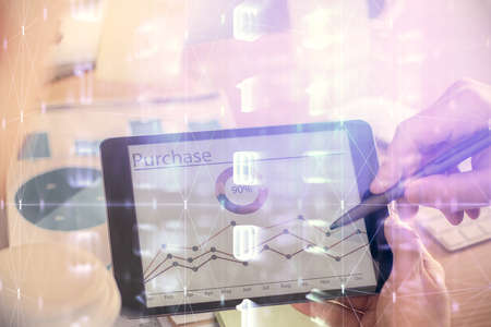 Multi exposure of man's hands holding and using a digital device and data theme drawing. Innovation concept.の写真素材