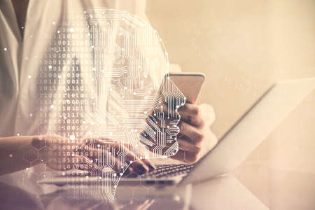 Double exposure of brain sketch hologram and woman holding and using a mobile device.の写真素材