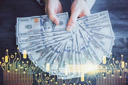 Multi exposure of technology drawing hologram and us dollars bills and man hands. Data conceptの写真素材