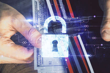 Double exposure of lock drawing hologram and us dollars bills and man hands. Security concept