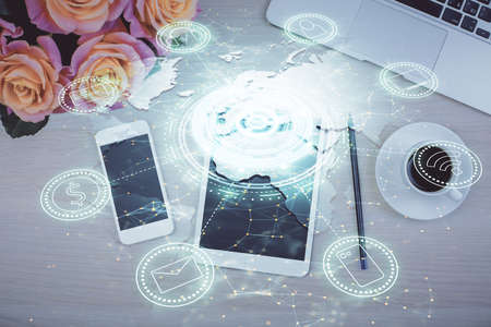 Double exposure of social network theme drawing over table with phone. Top view. People connecting...