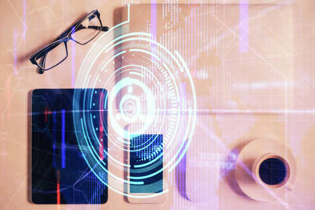 Double exposure of technology theme drawing over work table desktop. Top view. Global data analysis...