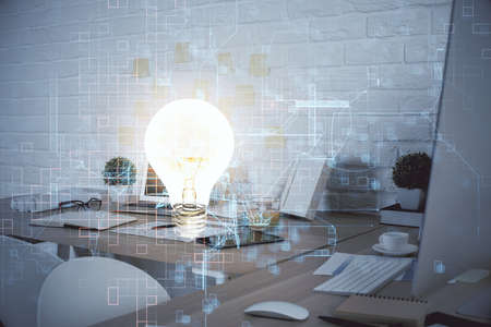 Double exposure of bulb and office interior background. Concept of idea.の写真素材