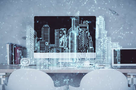 Multi exposure of town drawings and office interior background. Smart city concept.