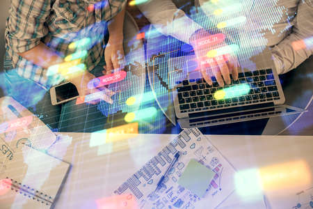 Double exposure of man and woman working together and data theme hologram drawing. Computer...