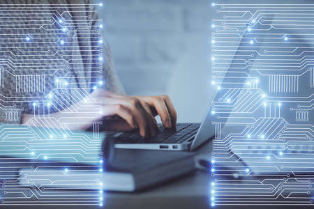 Double exposure of woman hands typing on computer and technology theme drawing. High Tech concept.