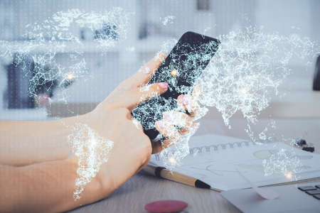 Double exposure of man's hands holding and using a phone and social network theme drawing.の写真素材