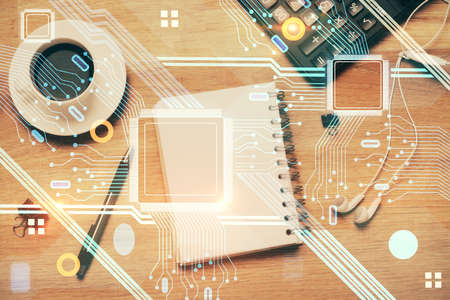 Double exposure of technology theme drawing over work table desktop. Top view. Global data analysis...