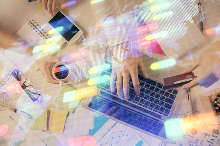 Double exposure of man's hands typing over computer keyboard and data theme hologram drawing. Top...