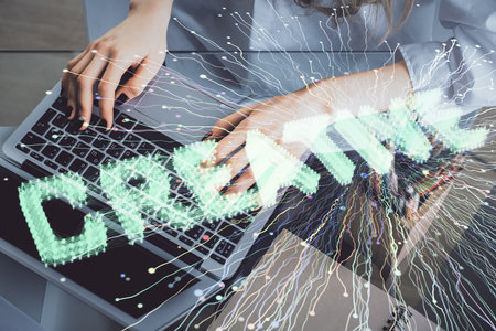 Double exposure of woman hands typing on computer and creative drawing. Start up concept.の写真素材