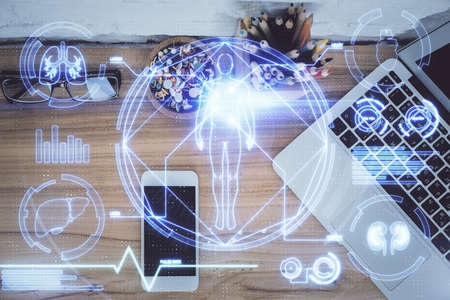 Double exposure of education theme drawing over table with phone. Top view. Science education...