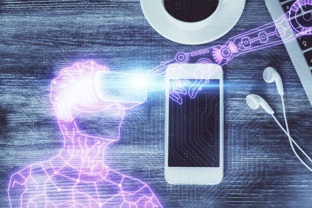 Double exposure of drawing man in AR glasses over table with phone. Top view. VR concept.の写真素材