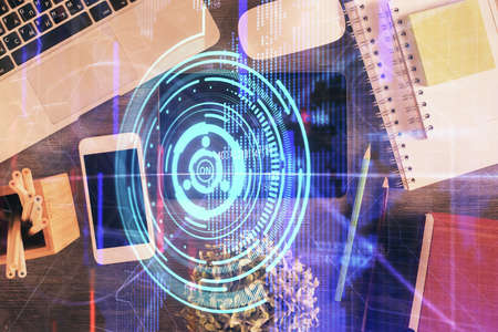 Double exposure of technology theme drawing over work table desktop. Top view. Global data analysis...