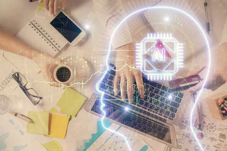 Double exposure of man's hands typing over computer keyboard and brain hologram drawing. Top view....