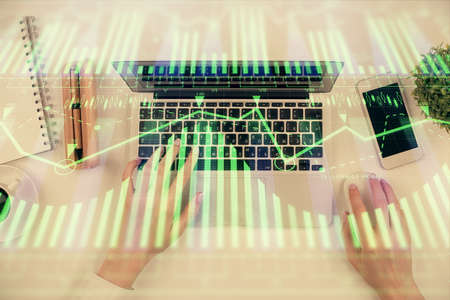 Double exposure of woman hands working on computer and data theme hologram drawing. Top View....