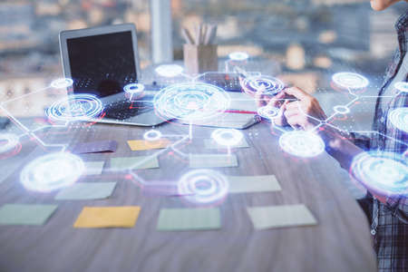 Double exposure of woman hands typing on computer and social network theme hologram drawing. People media concept.の写真素材
