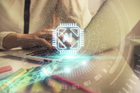 Multi exposure of woman hands working on computer and data theme hologram drawing. Tech concept.の写真素材