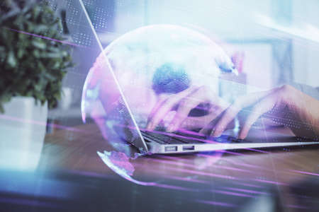 Double exposure of woman hands typing on computer and technology theme drawing. High Tech concept.の写真素材