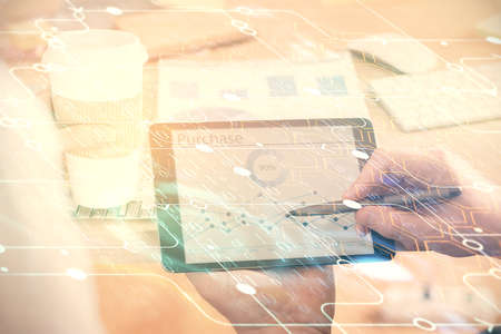 Multi exposure of man's hands holding and using a digital device and data theme drawing. Innovation concept.の写真素材