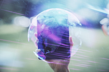 Double exposure of tech icon hologram and woman holding and using a mobile device. Technology concept.の写真素材