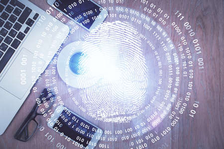 Double exposure of finger print over table with phone. Top view. Concept of mobile security.の写真素材