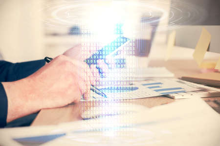 Multi exposure of man's hands holding and using a digital device and data theme drawing. Innovation...