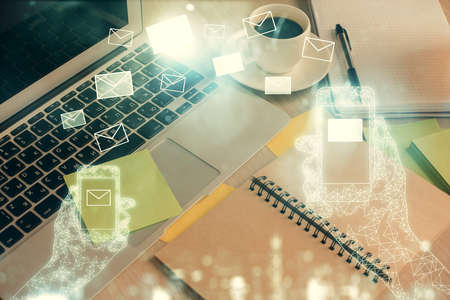 Double exposure of envelope drawing and desktop with coffee and items on table background. Concept...