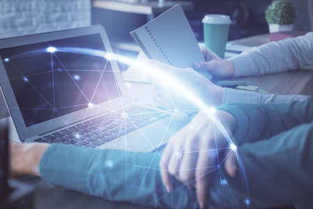 Double exposure of man and woman working together and social network theme hologram drawing. People...