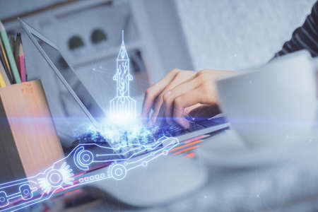Double exposure of woman hands typing on computer and creative drawing. Start up concept.