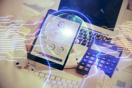 Double exposure of man's hand holding and using a digital device and brain hologram drawing. Data...