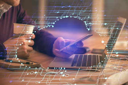 Multi exposure of man's hands holding and using a digital device and data theme drawing. Innovation...