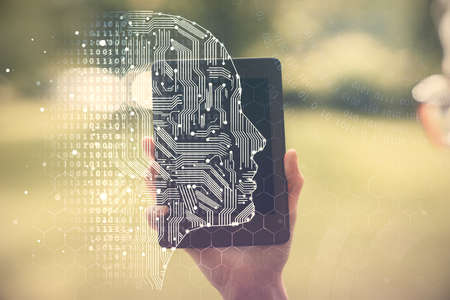 Double exposure of brain sketch hologram and woman holding and using a mobile device.の写真素材