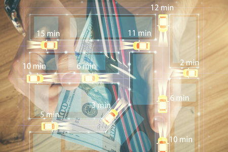 Multi exposure of Tech taxi drawing hologram and USA dollars bills and man hands. Technology concept.の写真素材