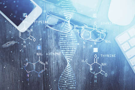 Double exposure of DNA drawing over table with phone. Top view. Science education concept.の写真素材