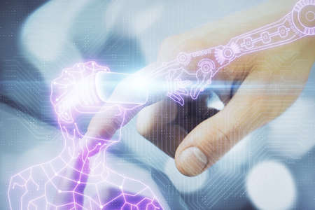 Double exposure of man's hands holding and using a digital device and AR glasses drawing. Virtual...